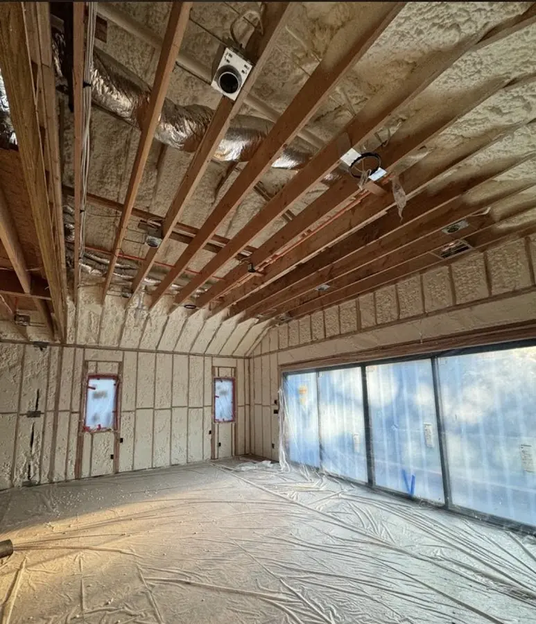 Interior walls and ceiling insulated with spray foam during new construction in Fulshear